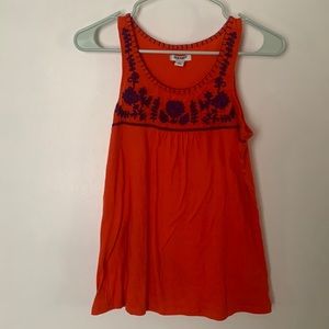 Orange sleeveless tank, purple embroidery